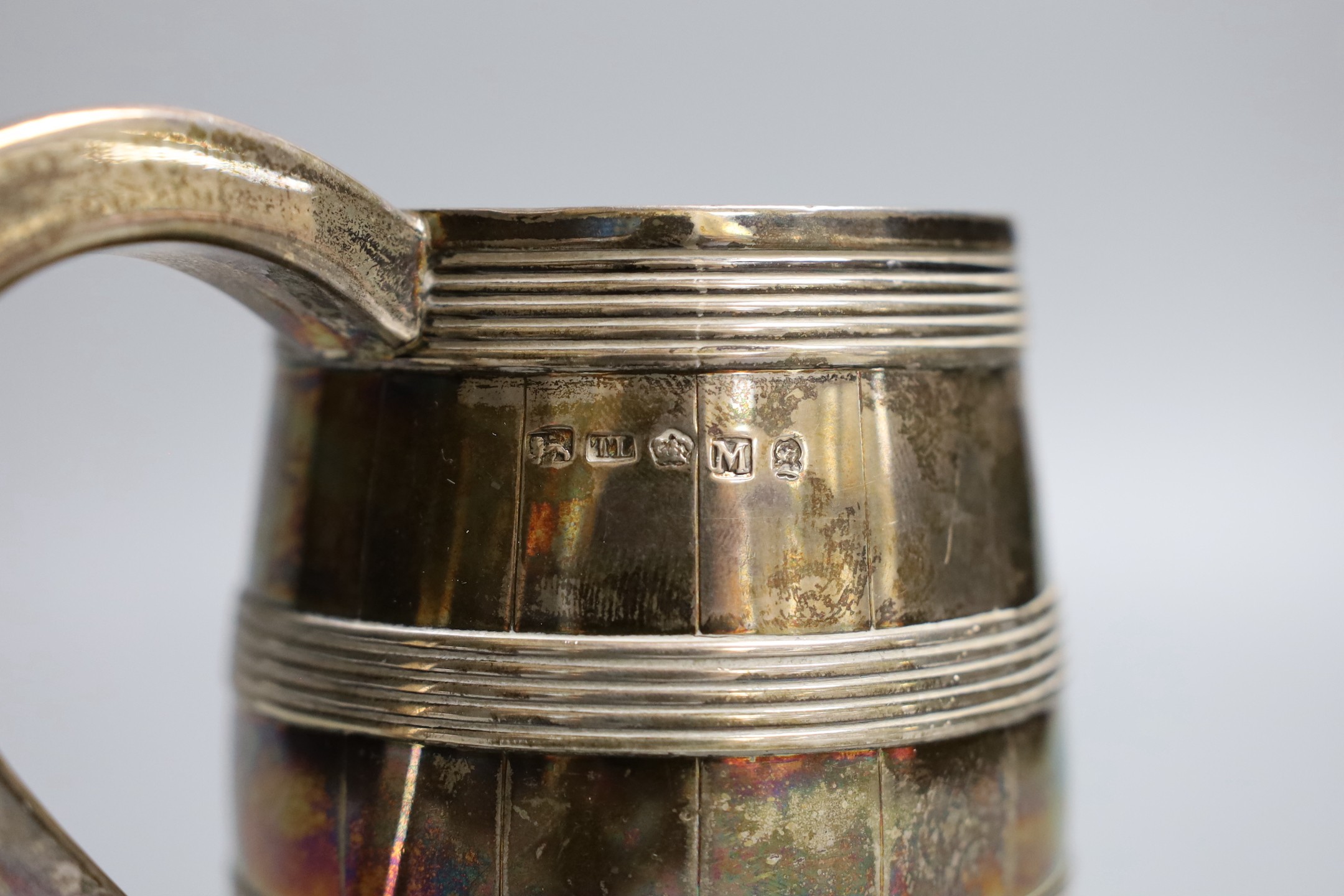 A George III silver barrel shaped pint mug, with reeded bands, Thomas Law, Sheffield, 1802, 12.7cm, 9.50z.